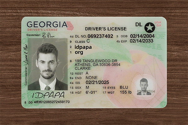 Georgia driver’s license novelty card with photo, ID details, and IDpapa branding on a wooden surface